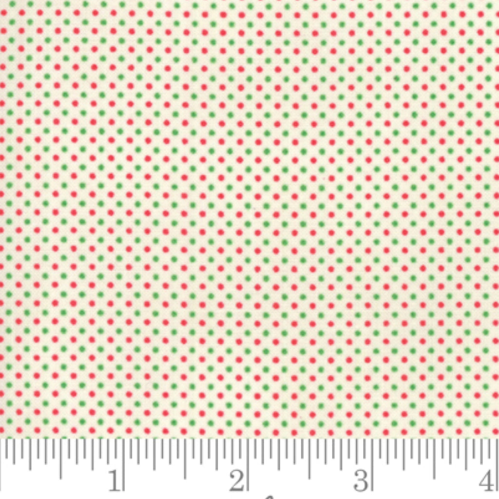 A piece of fabric featuring a white background with a pattern of red and green dots, measuring 112cm in width, displayed next to a ruler for scale.