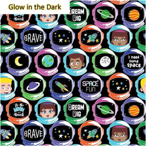 A piece of fabric featuring various characters and astronaut motifs with text such as 'Brave' and 'Dream Big', predominantly in dark colors, designed to glow in the dark.