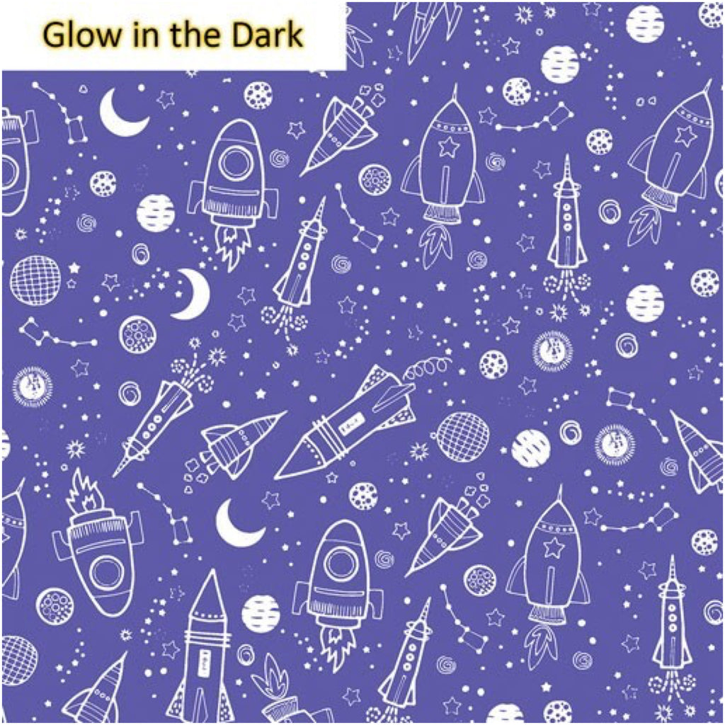 A fabric featuring a purple background with a pattern of white rockets, planets, and stars, labeled 'Glow in the Dark'.