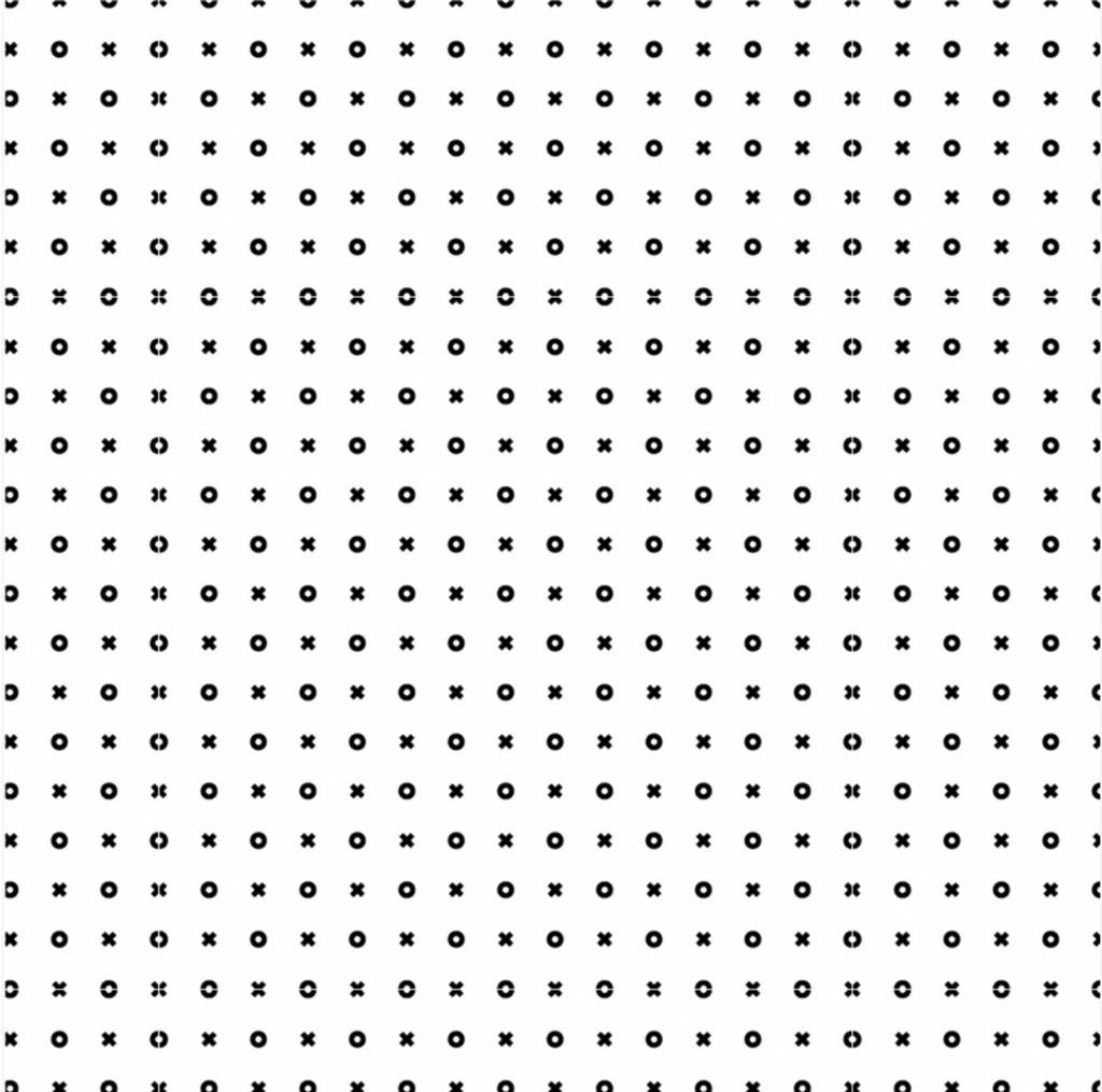 A fabric with a white and black geometric pattern, consisting of circles and crosses.