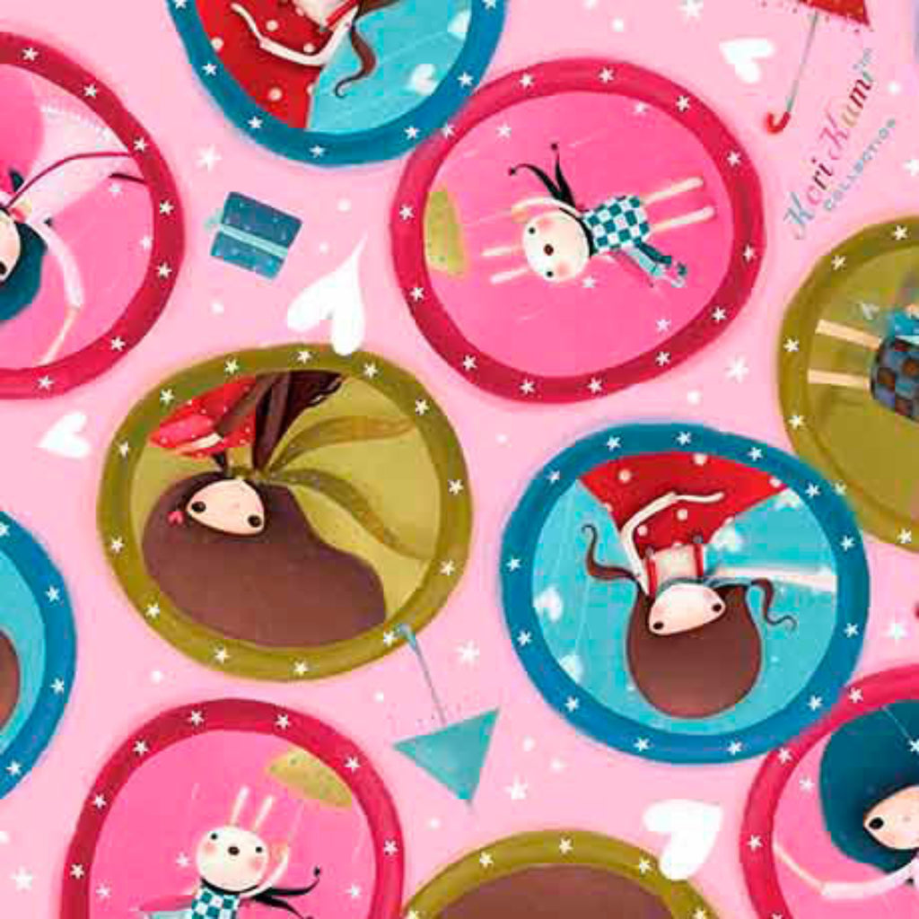 Round pink fabric medallions featuring various cartoon girl characters in different poses and designs.