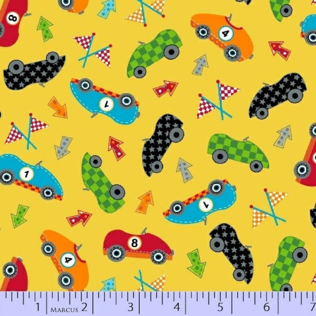 Colorful pattern of toy cars and racing elements on a yellow background with a ruler at the bottom.