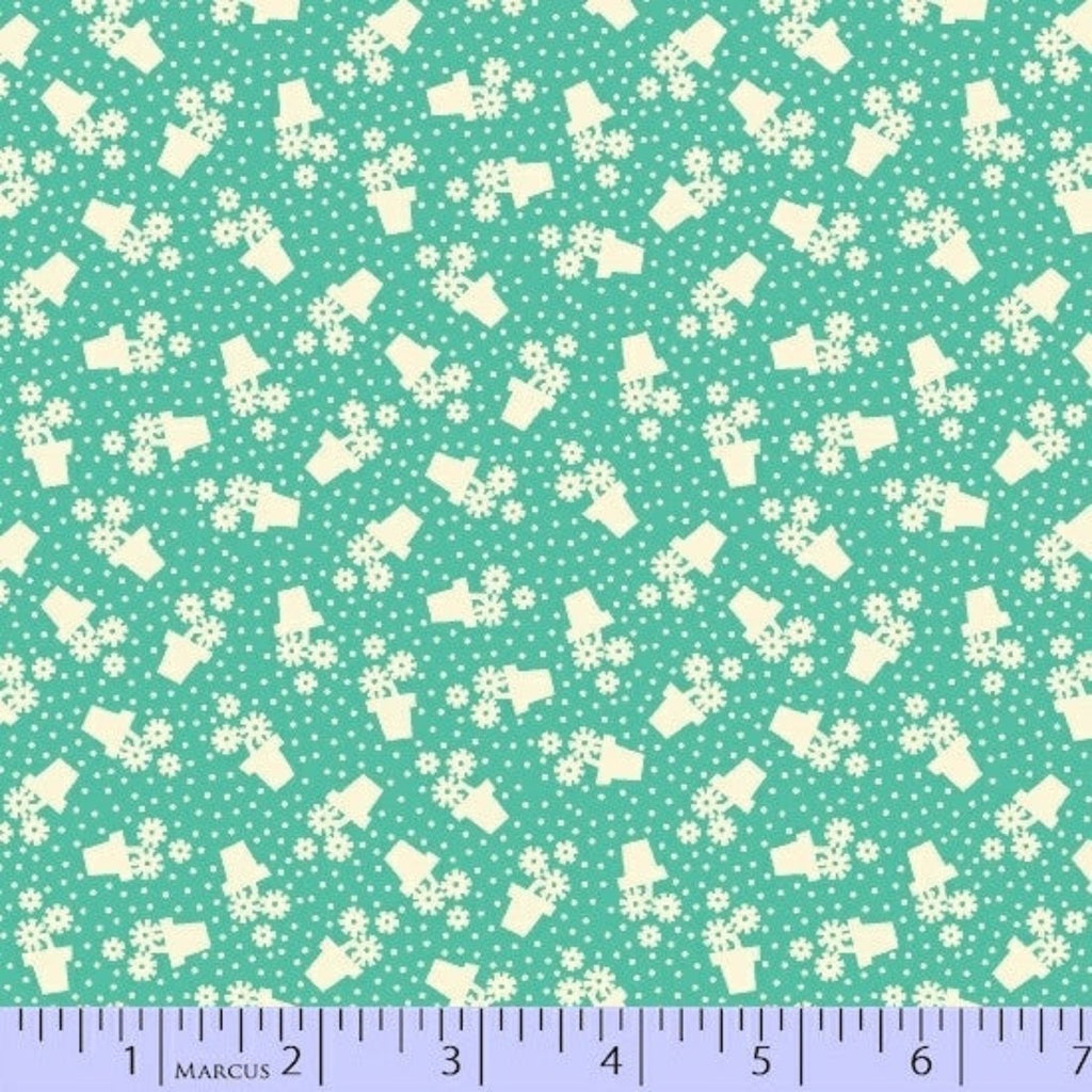 Fabric with white floral patterns on a teal background, featuring a Marcus brand ruler at the bottom.