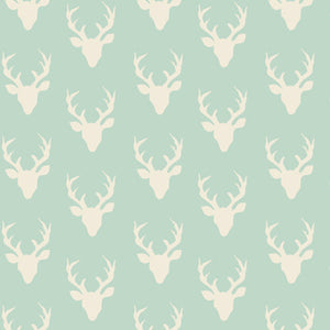 Pattern of white deer heads on a light blue background