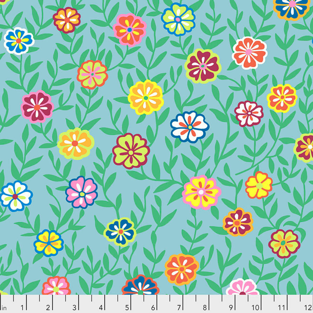 A turquoise fabric with a floral pattern featuring various colors such as red, yellow, and blue.