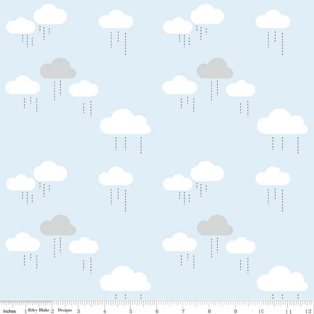 A piece of fabric featuring a blue sky with white clouds pattern, intended for use in sewing and crafting projects.