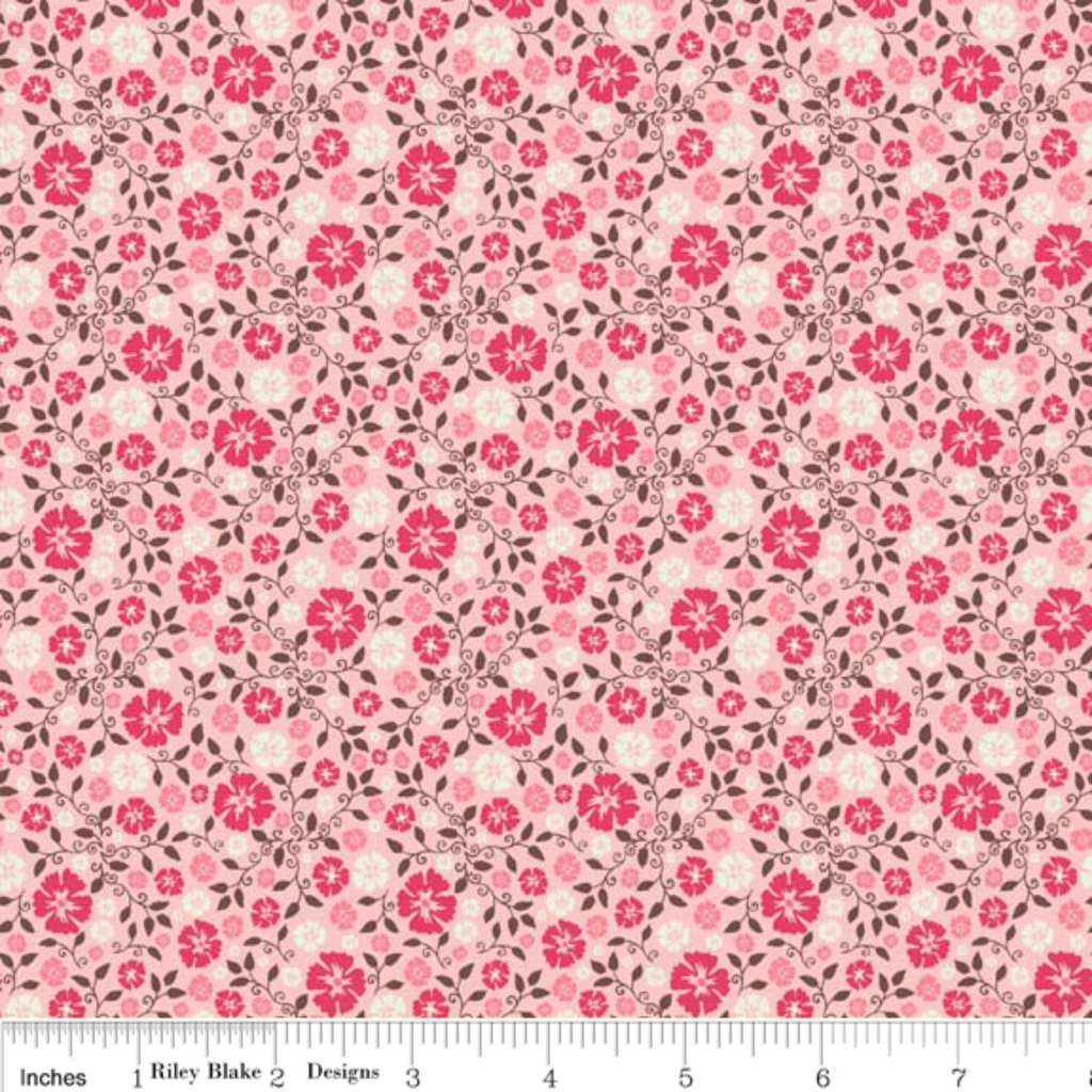 A fabric featuring a pink floral pattern on a beige background, labeled as part of the Cowboy Up collection.