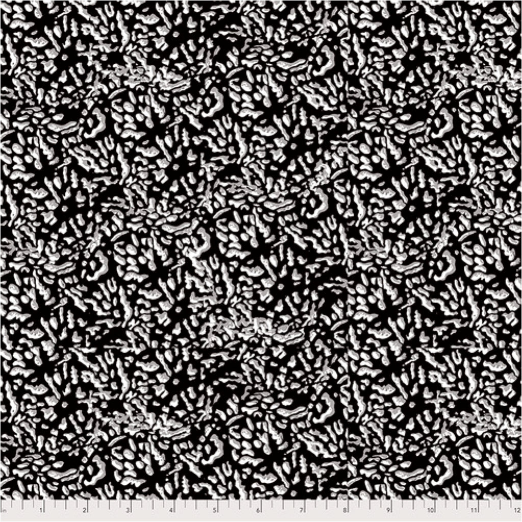 A textile design featuring a close-up pattern of turtle shells in black and white, part of the collection inspired by the River Ember.