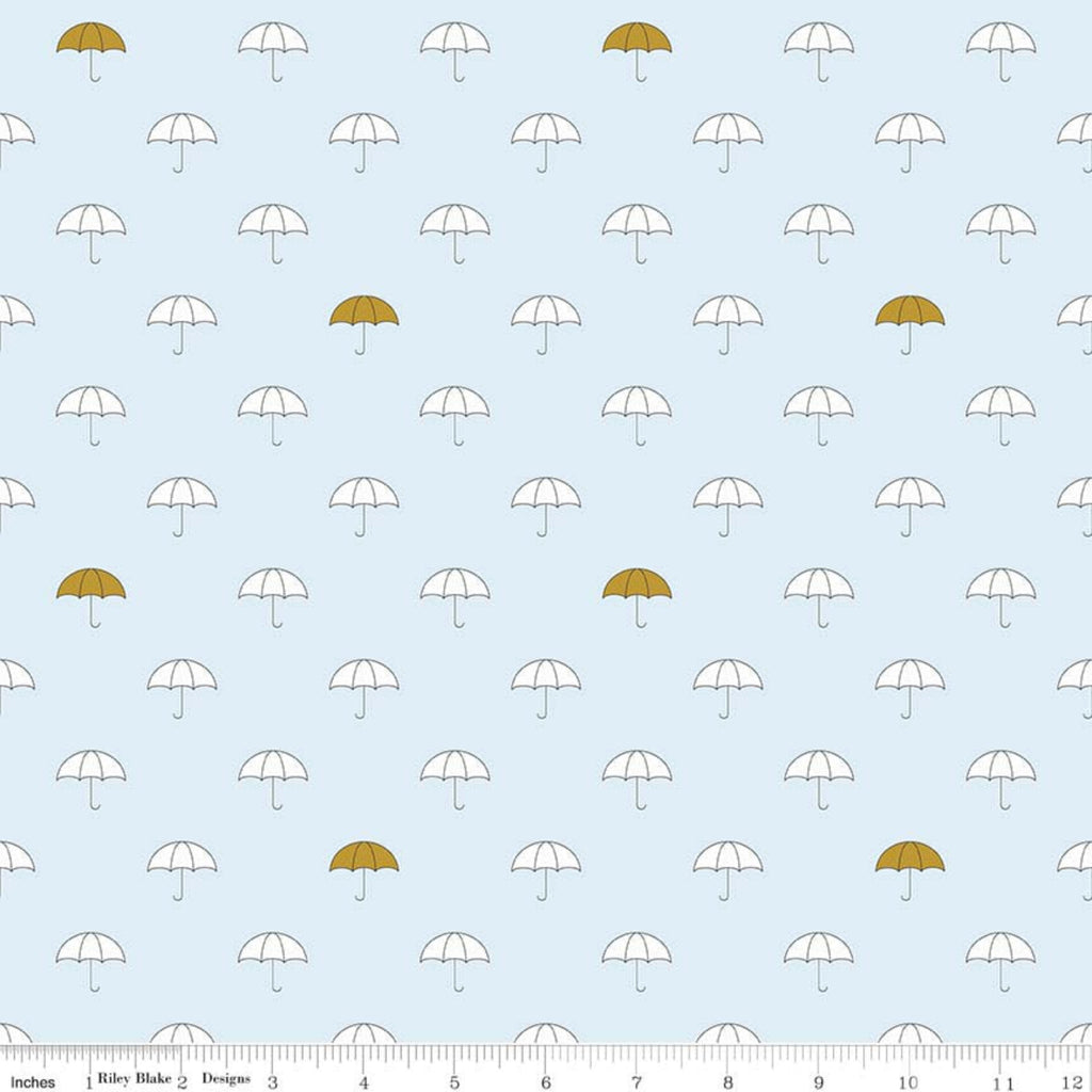 A fabric featuring a pattern of white umbrellas with gold accents on a blue background.