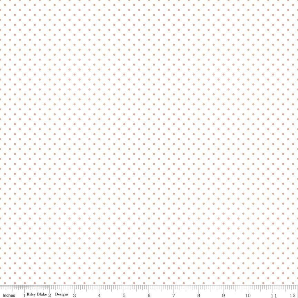 A piece of fabric featuring rose gold metallic dots on a white background, with a measuring label.