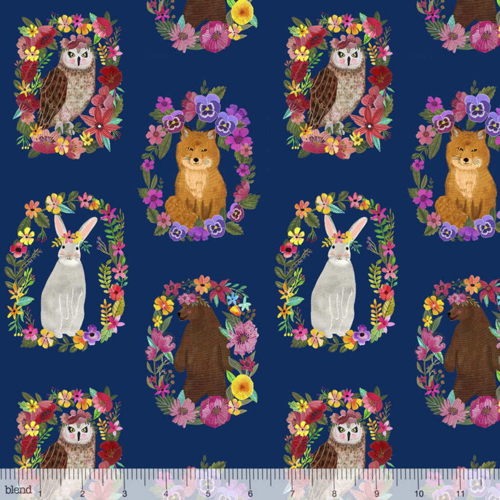 Pattern of forest animals like fox, owl, and rabbit surrounded by flowers on a blue background.