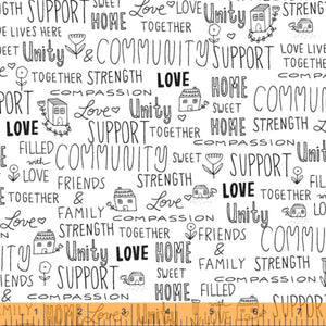 A fabric with a white background featuring a pattern of black text and illustrations related to the theme of love and support, such as the words 'Love', 'Strong', and various home-related images like houses and trees.