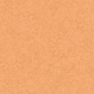 Close-up view of a textured apricot-colored fabric.