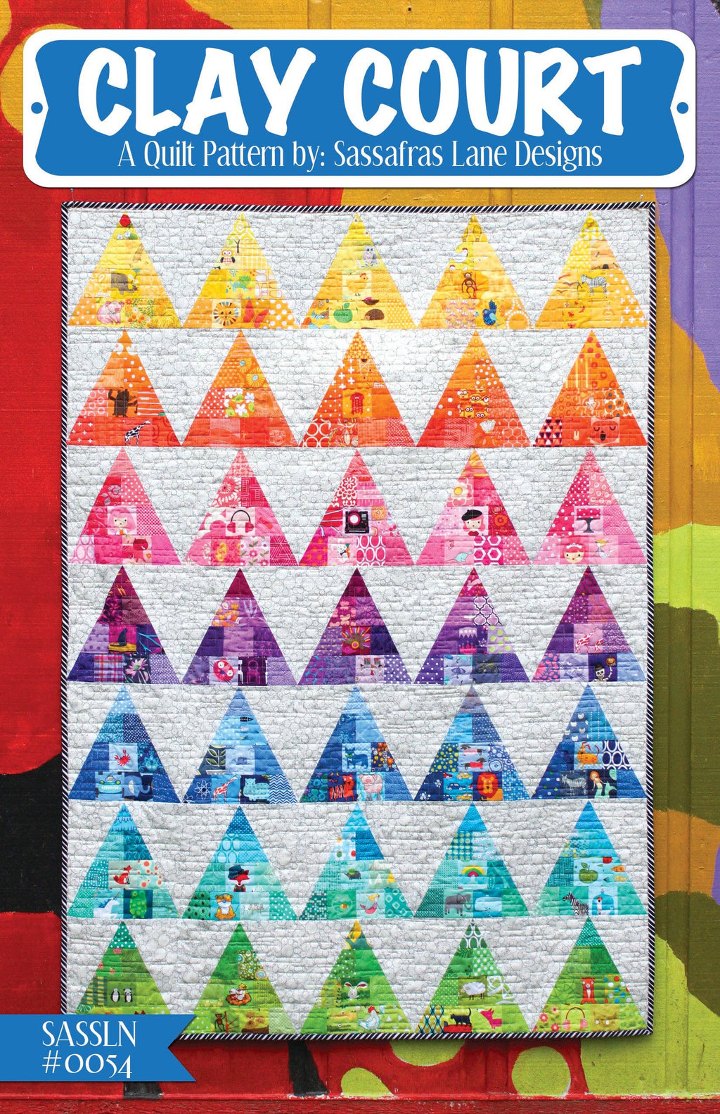 A colorful quilt pattern named Clay Court, featuring arranged triangular patches in various colors.
