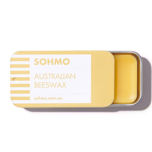 Yellow Australian Beeswax bar in a tin with 'SOHMO' branding on a white background