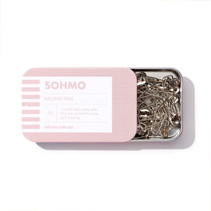 Pink tin of SOHMO basting pins on a white background