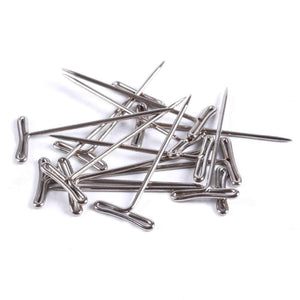 Metal pins on a white background