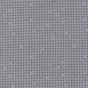 A fabric with a modern geometric cross pattern in a grey color.