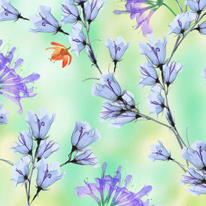 A fabric with a floral branch design featuring colors green, purple, and jade.