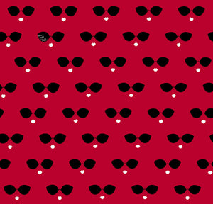 Pattern of black sunglasses with white hearts on a red background