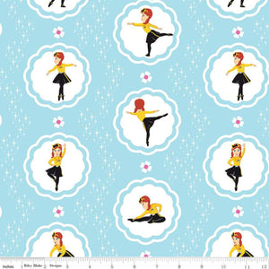 Fabric featuring character illustrations of Emma Watkins from The Wiggles in various dancing poses, surrounded by scalloped circles on a blue background with stars and flowers.