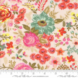A piece of fabric featuring a floral pattern with prominent pink, green, and red flowers, and yellow background, with a ruler at the bottom showing the measurement scale.