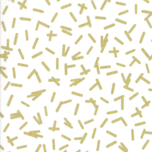 A piece of fabric featuring a white background with gold metallic geometric shapes.