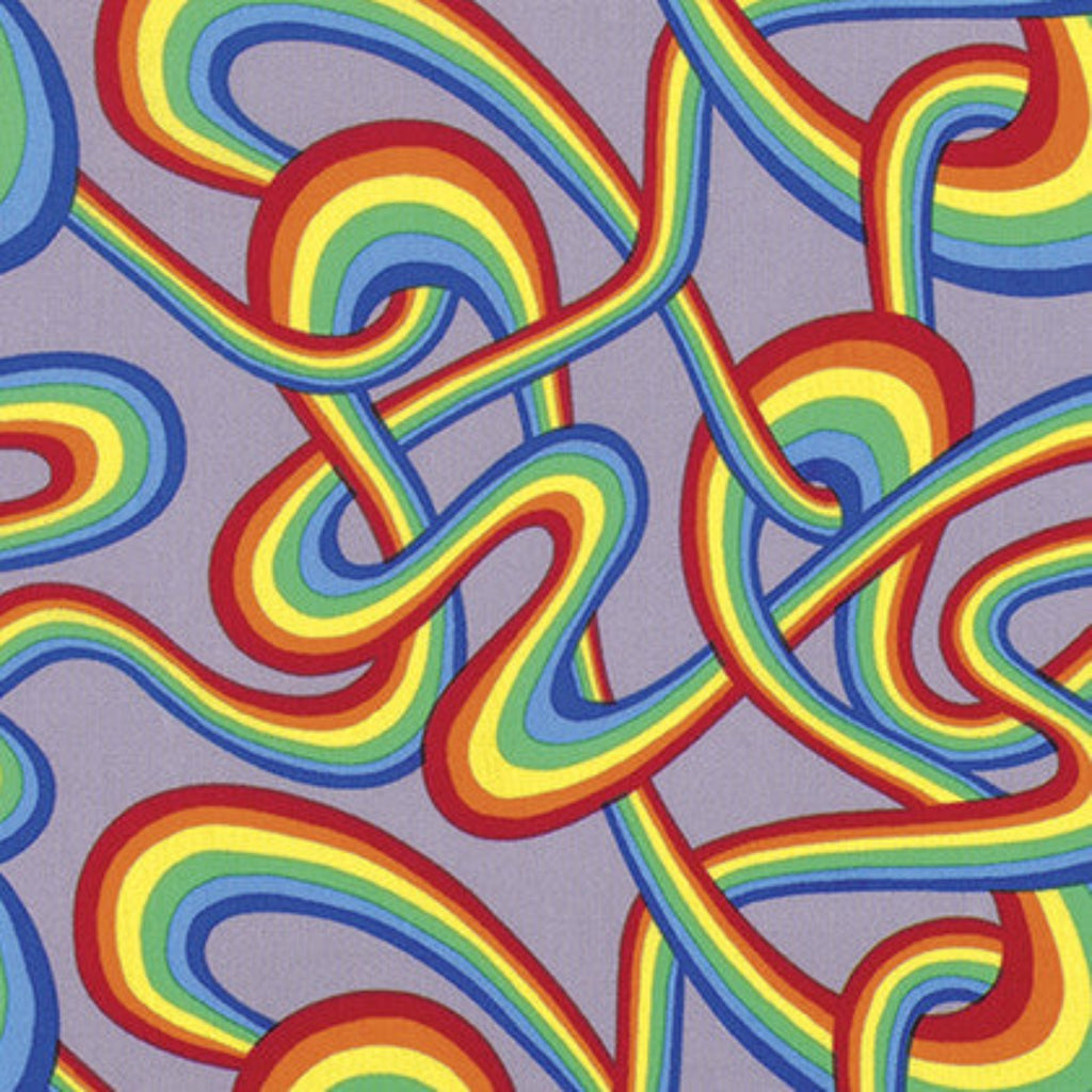 A piece of fabric with a colorful geometric pattern featuring rainbow-colored stripes.