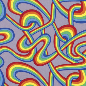 A piece of fabric with a colorful geometric pattern featuring rainbow-colored stripes.
